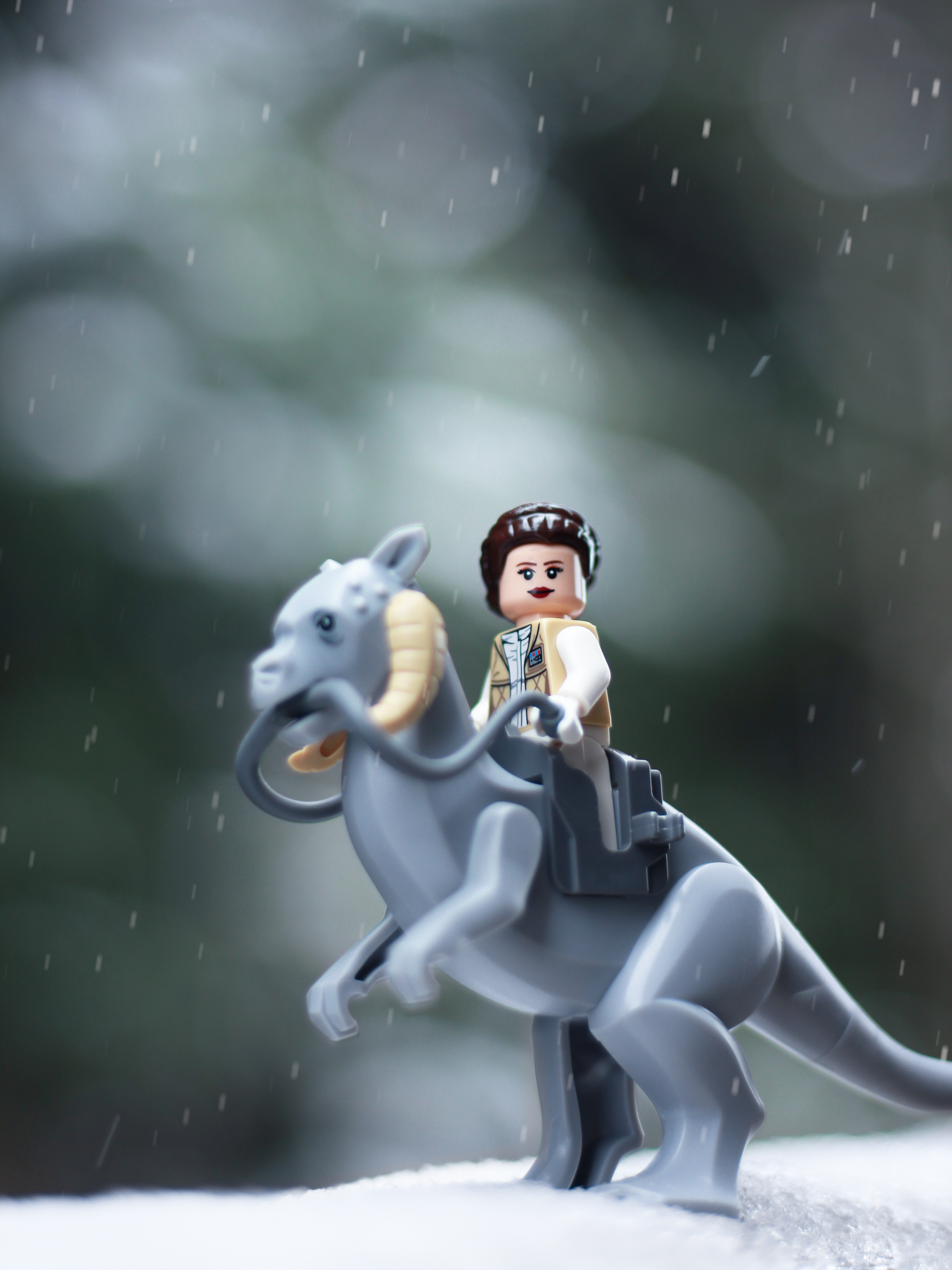 lego star wars princess leia riding a tauntaun in the snow