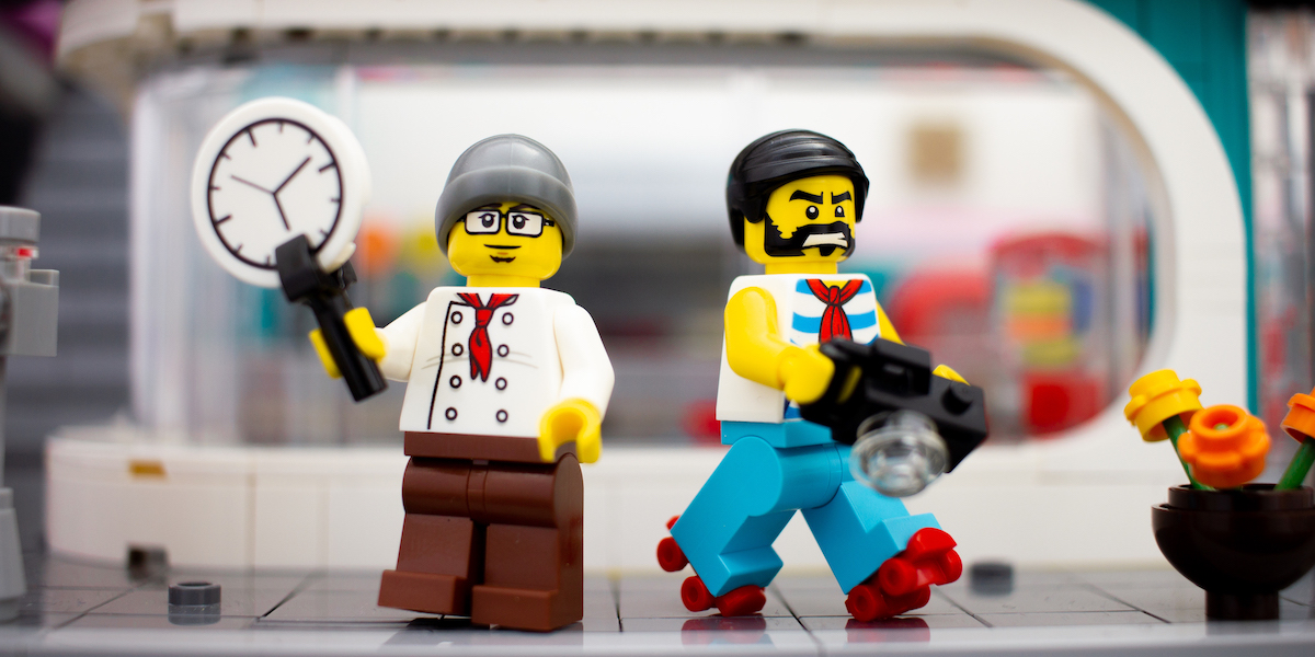 LEGO minifigures outside Downtown Diner modular by James Garcia