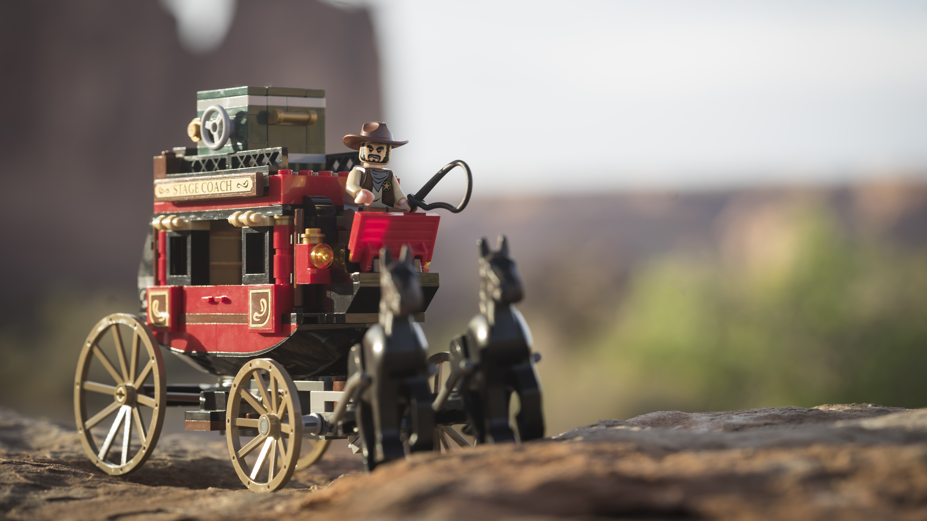 LEGO stage coach and two lego horses in the fading light of Arches NP, Utah