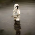The Prototype Bob Fett walks on water proving that he is indeed a god in this grey, dark, atmospheric outdoor toy photography.