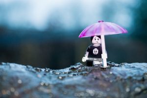 LEGO boy with pink umbrella