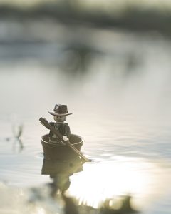 LEGO Indian Jones paddles across lake at sunrise. Photo by Shelly Corbett