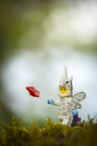 LEGO unicorn with wings chases butterfly through forest photo by Shelly Corbett