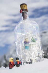 Two LEGO minifigures wait their turn to ski down the mountain in the LEGO Ship in a Bottle. Photo by Shelly Corbett