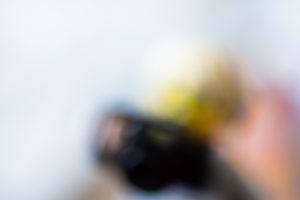A very blurry photo of a LEGO figure with a camera