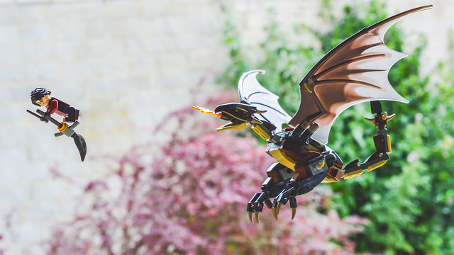 LEGO Harry Potter being chased by a dragon.