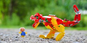 LEGO dinosaur chasing piggy