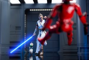 Star Wars the Black Series Rey Force pushes a Sith trooper action figure from The Rise of Skywalker