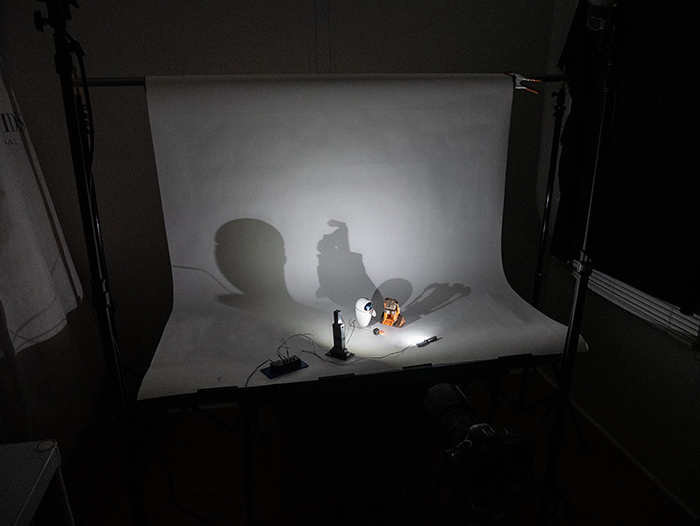 Overall BTS image showing a light-controlled environment.