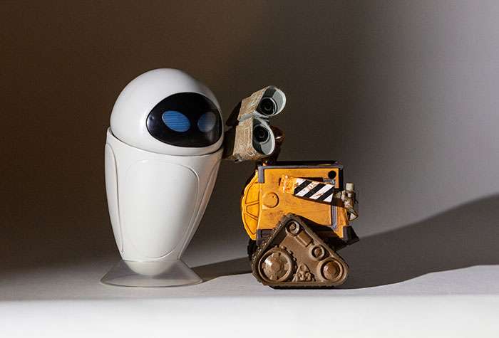 Wall-E and Eve lit with a single Lume Cube and barndoor set for the light fall-off just behind Eve.