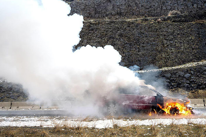 Car burning with smoke and fire