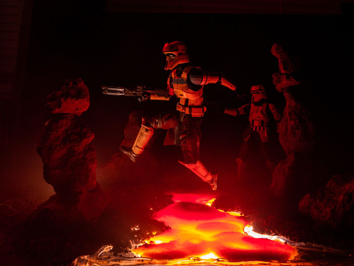 Scarif trooper action figure leaping over the lava.