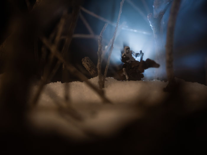 Speeder bike miniature zooming through the woods