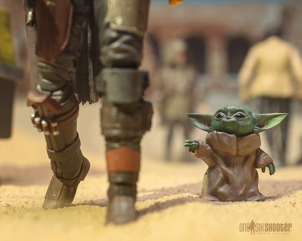 The Mandalorian holding Baby Yoda by Banana Wood