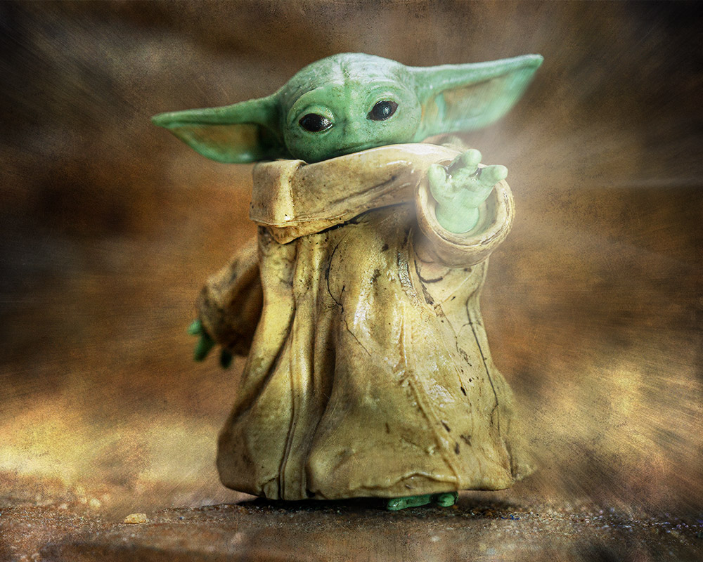 Baby Yoda doing the magic hand thing.