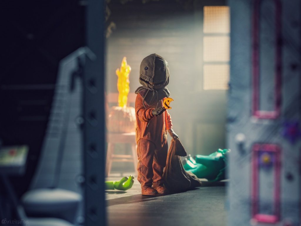 The Wring Door - NECA action figure of Sam from Trick 'r Treat behind the Monsters Inc. door with Mike and Sulley on the ground by Adam Burke, @burkeheadtoys