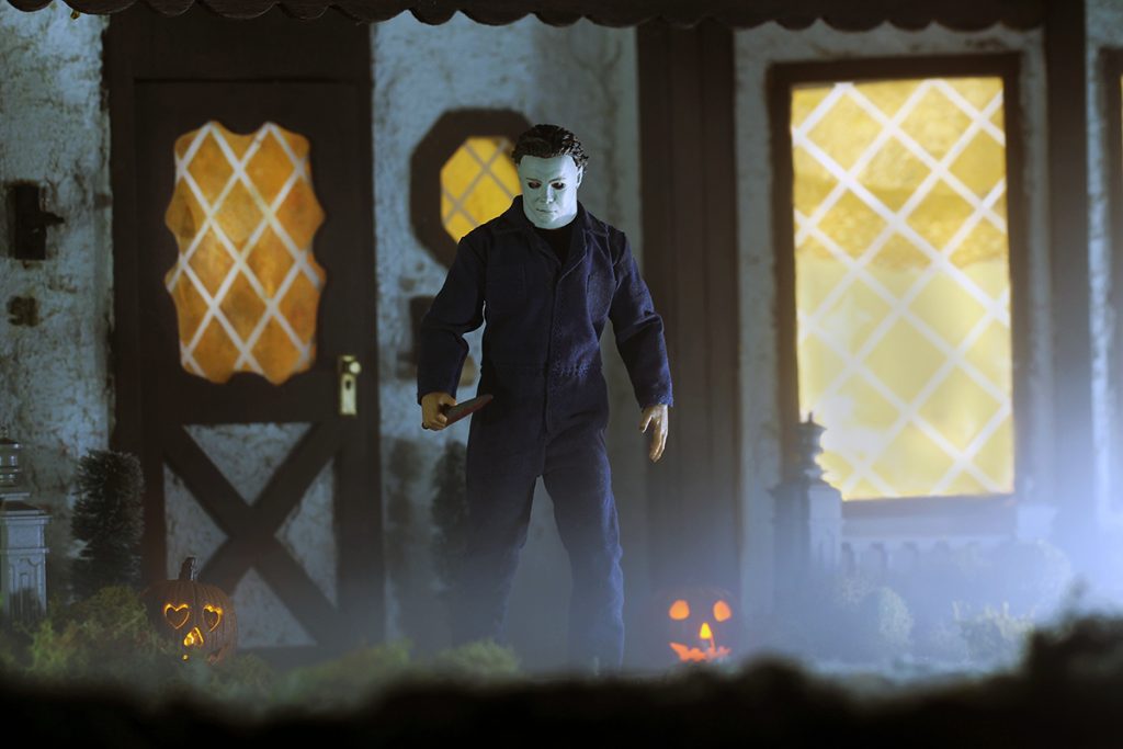 Mezco One:12 Collective Michael Myers action figure in front of large house closer