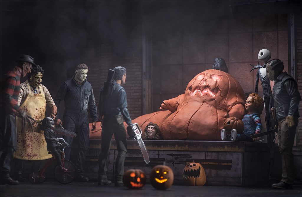 Jabba the Hutt as jack-o-lantern surrounded by NECA horror movie slasher action figures by @tuskenmilkbar