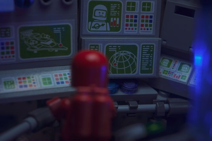 A LEGO built interior of spaceshit with screens and computers