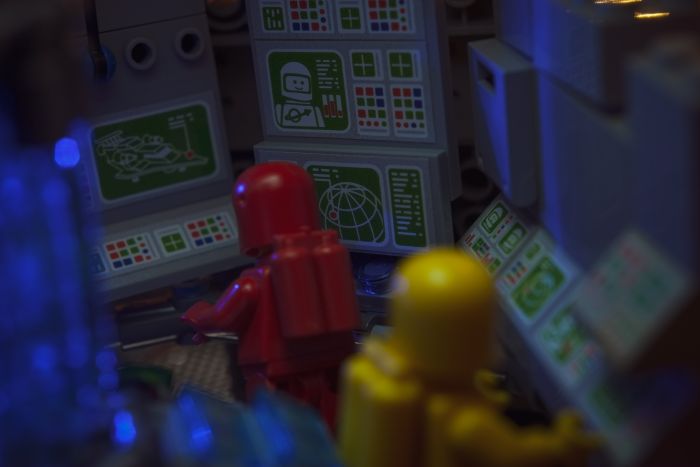 A LEGO built interior of spaceshit with screens and computers