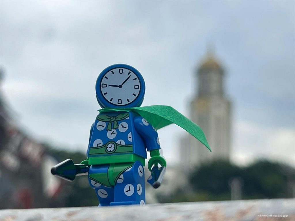 Lego  Clock King minifigure in urban landscape, with clock tower in the background