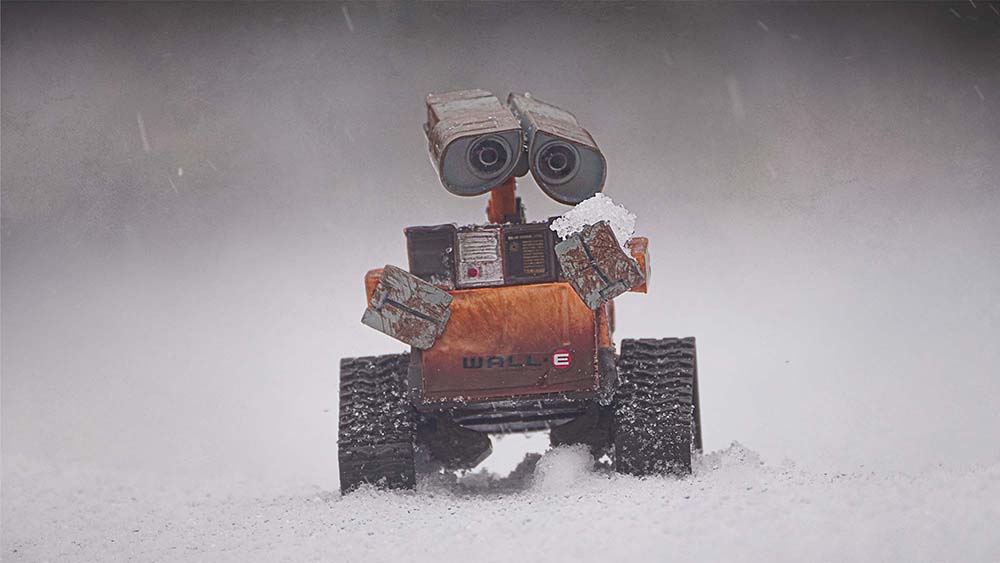 wall-e holding a snowball
