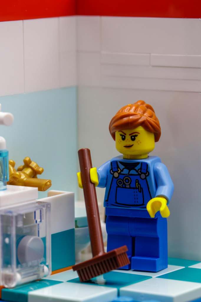 LEGO cleaning lady minifigure in the hospital's bathroom