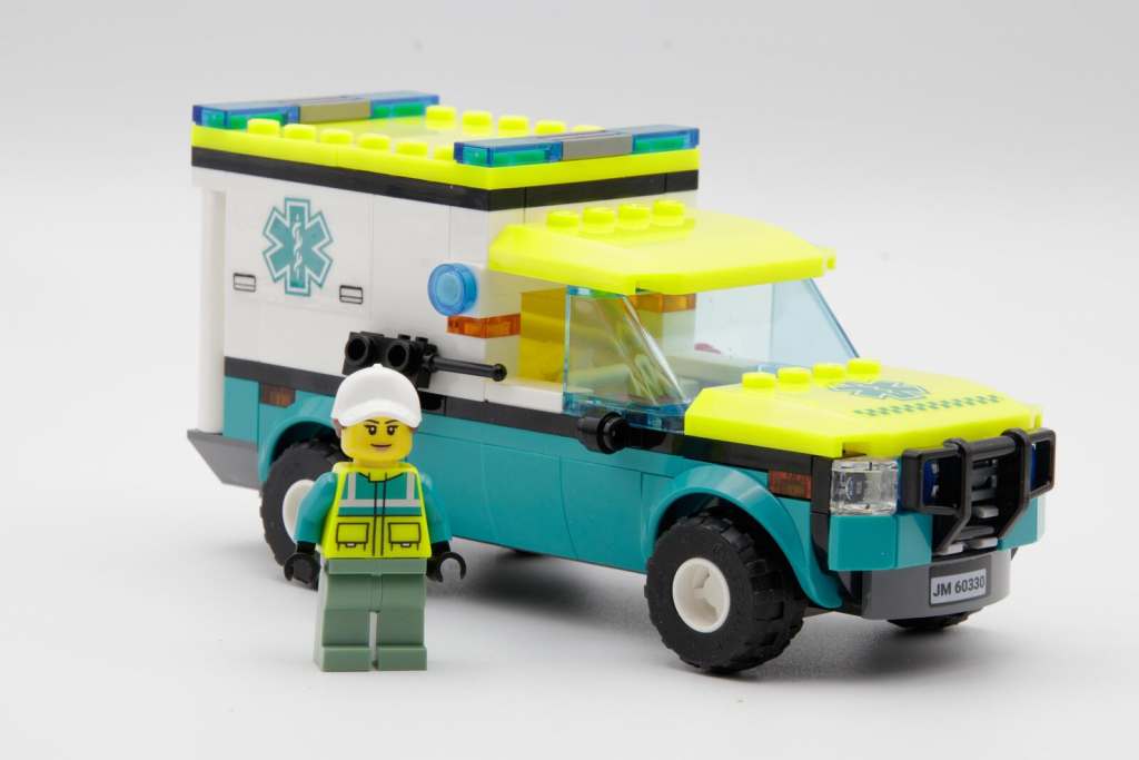 LEGO brick-built ambulance car with paramedic minifigure