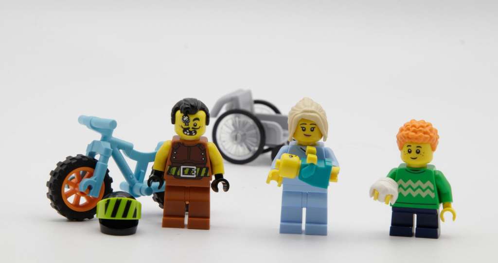Three LEGO minifigures - hospital patients