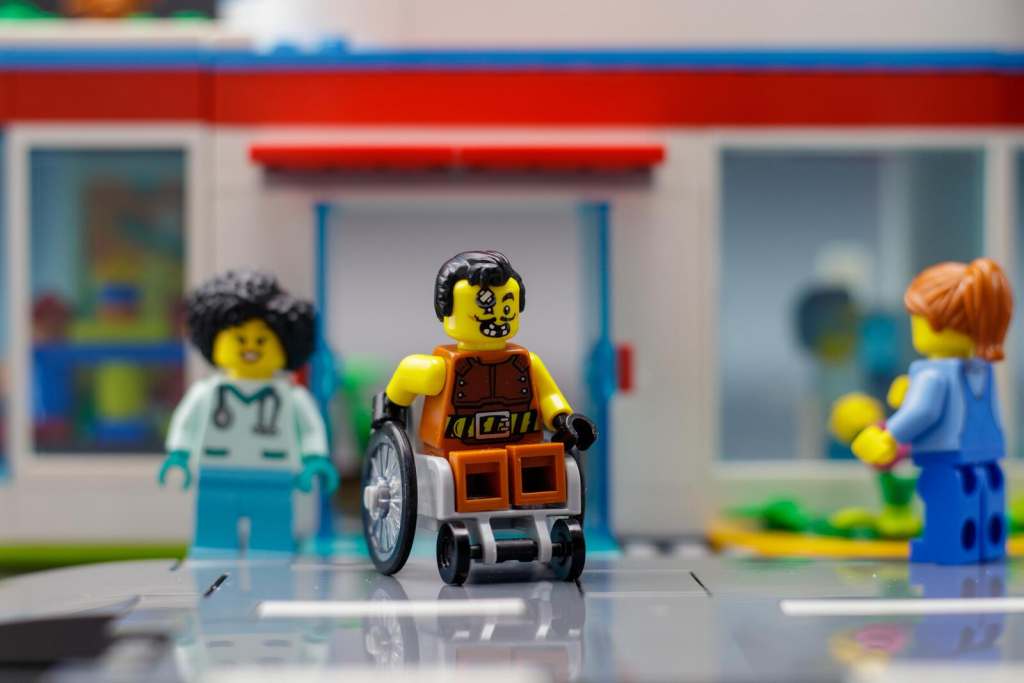 LEGO stunt biker minifigure leaving the hospital on the wheelchair 