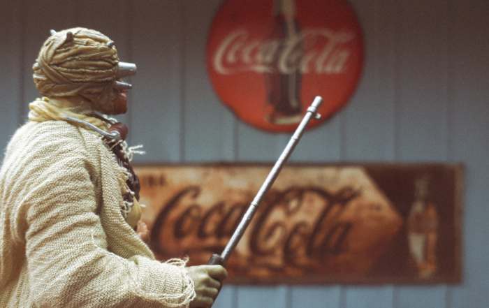 Tusken Raider in front of Coca Cola sign in new world