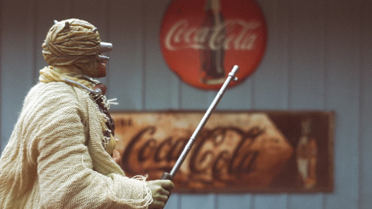 Tusken Raider in front of Coca Cola sign in new world
