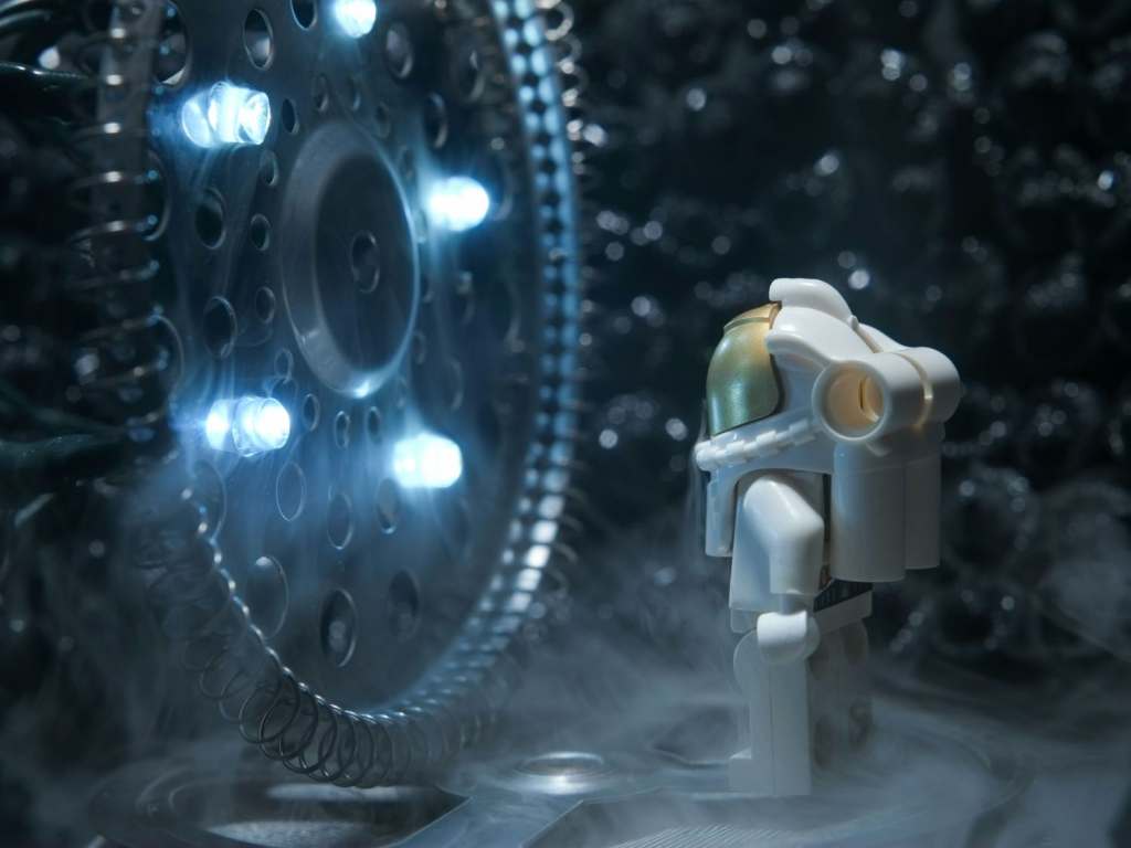 a Lego astronaut minifigure in DIY diorama using papier mache kitchen accessories and unripe acorns