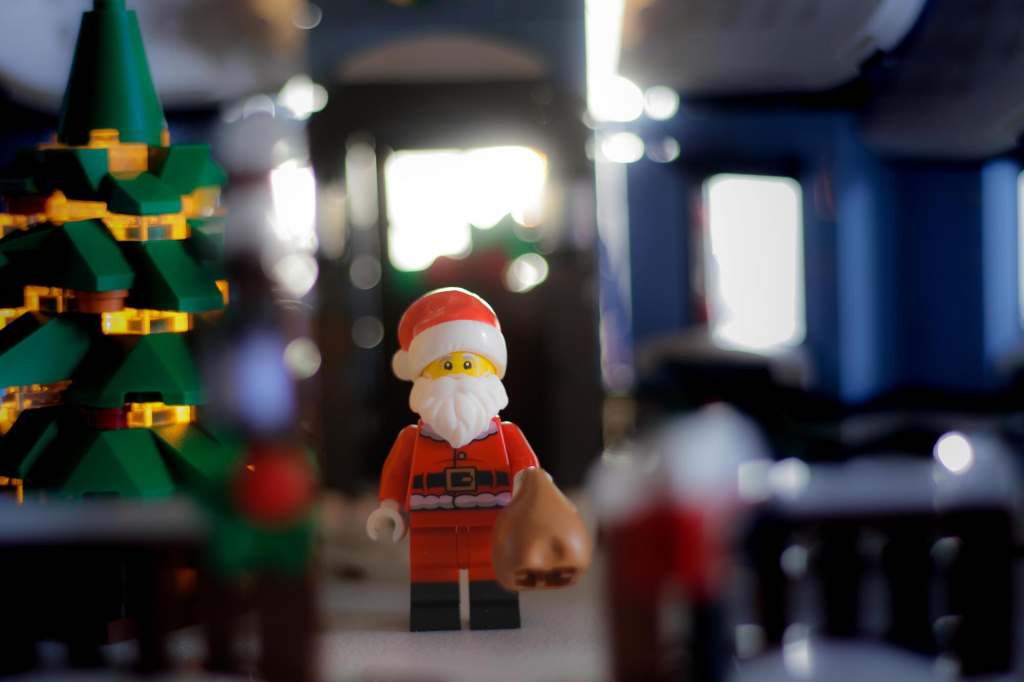 a Lego Santa Claus minifigure leaving house