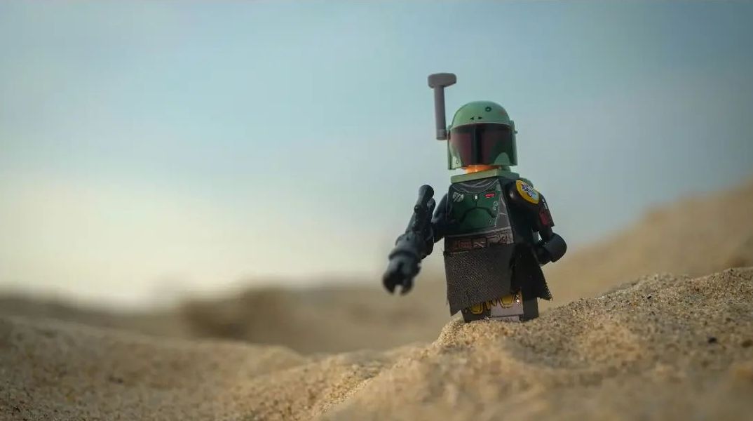 Lego Boba Fett minifigure on the sand dune