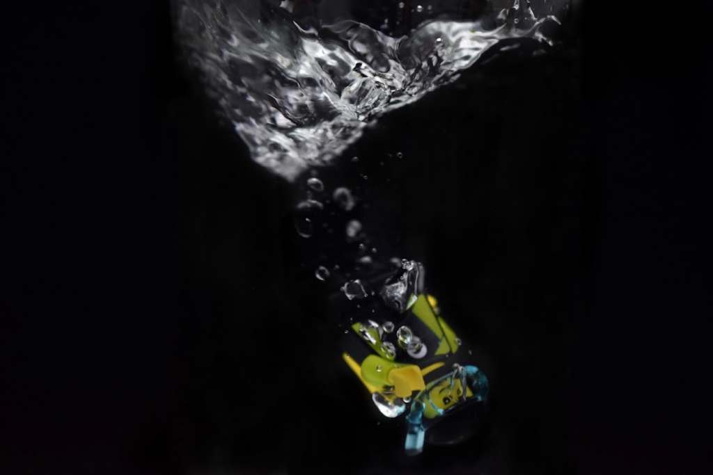 A LEGO diver minifigure submerging into the water

author: Tao Liao