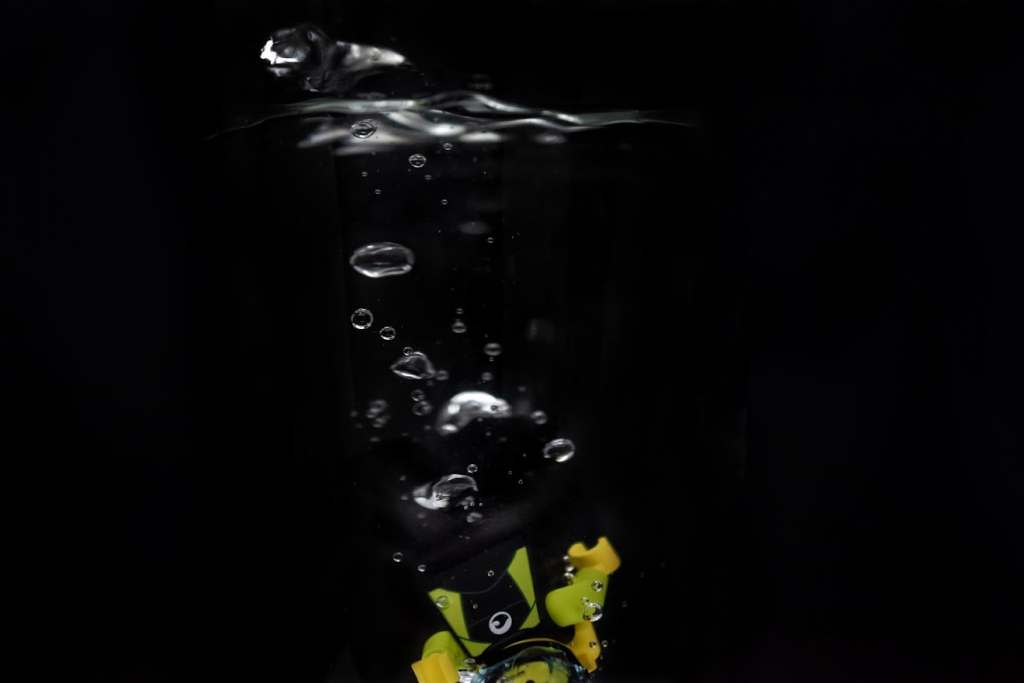 A LEGO diver minifigure submerging into the water

author: Tao Liao