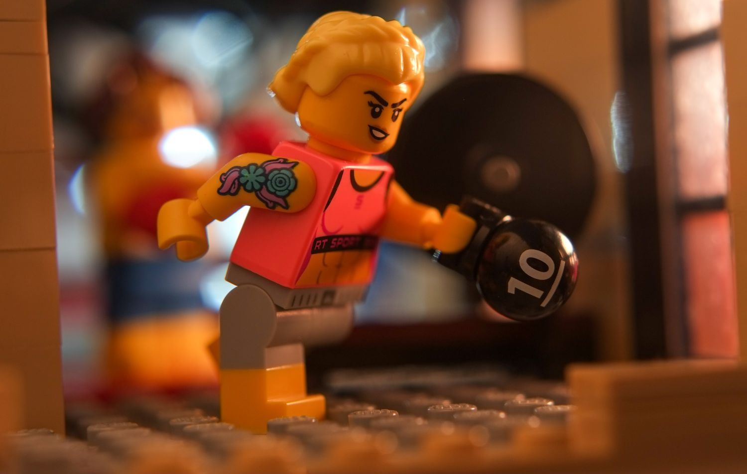 A LEGO Fitness Instructor during workout with kettlebell.