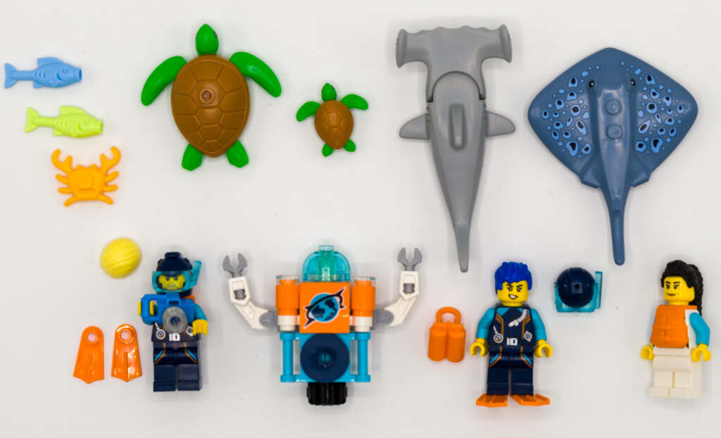 top down view of the minifigures and elements of LEGO 60377 set.