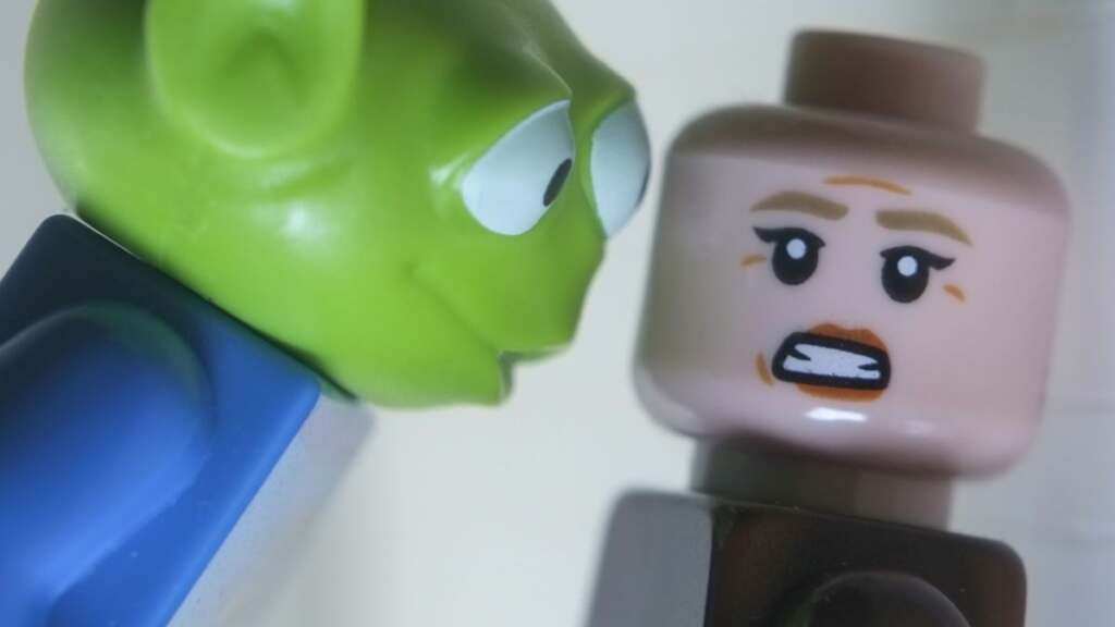 LEGO rendition of iconic close up scene from Alien 3 with Ellen Ripley and alien from Toy Story instead of xenomorph