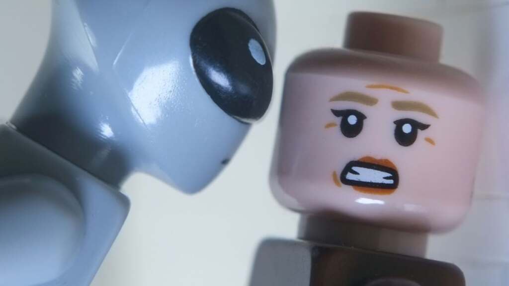 LEGO rendition of iconic close up scene from Alien 3 with Ellen Ripley and grey alien instead of xenomorph