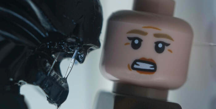 LEGO rendition of iconic close up scene from Alien 3 with Ellen Ripley and xenomorph