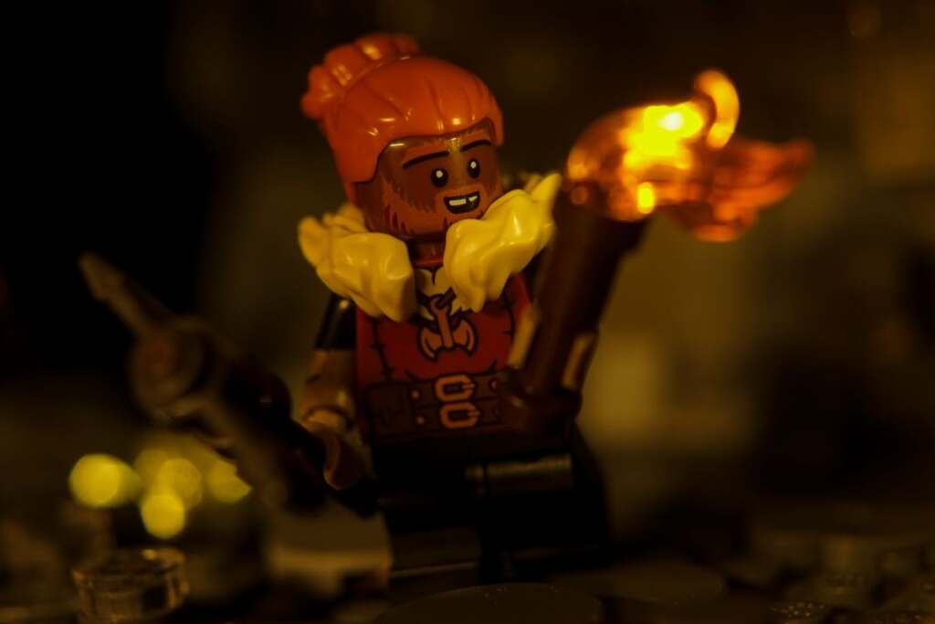 LEGO male dwarf barbarian minifigure with axe and torch