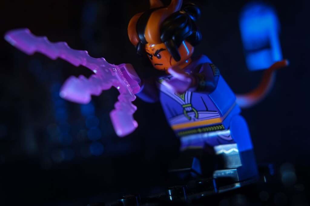 LEGO male Tiefling Sorcerer casting a spell