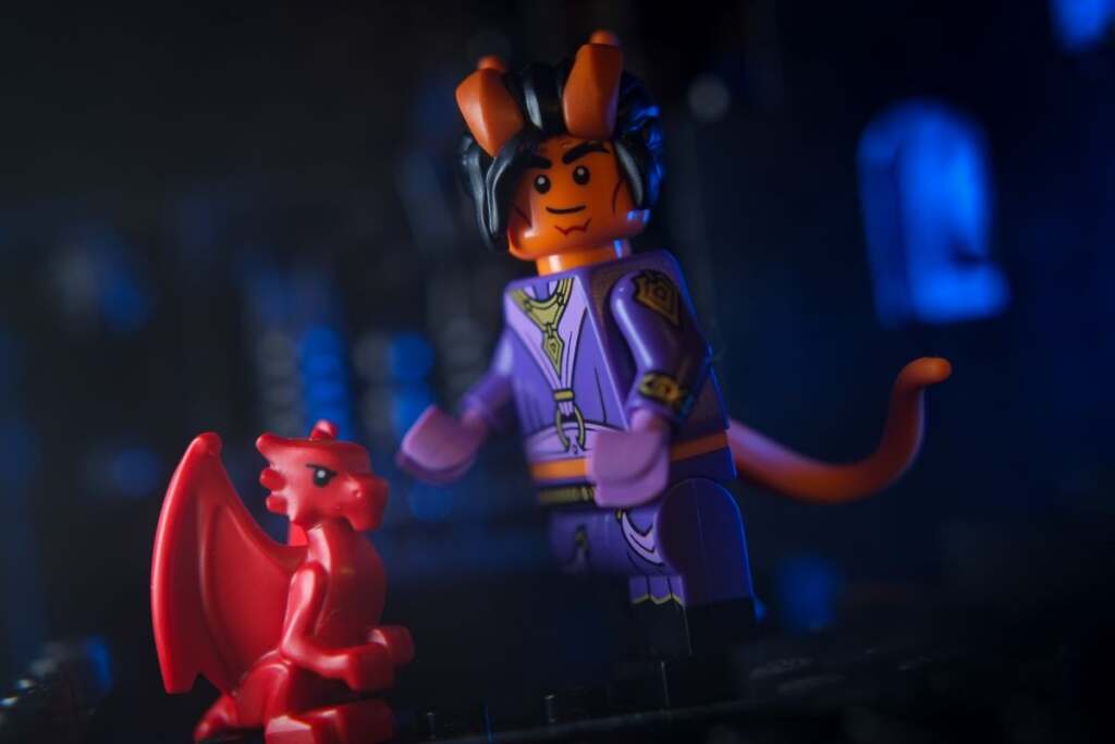 LEGO male Tiefling Sorcerer with red baby dragon