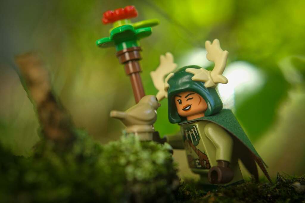 LEGO female Halfling Druid smiling at bird