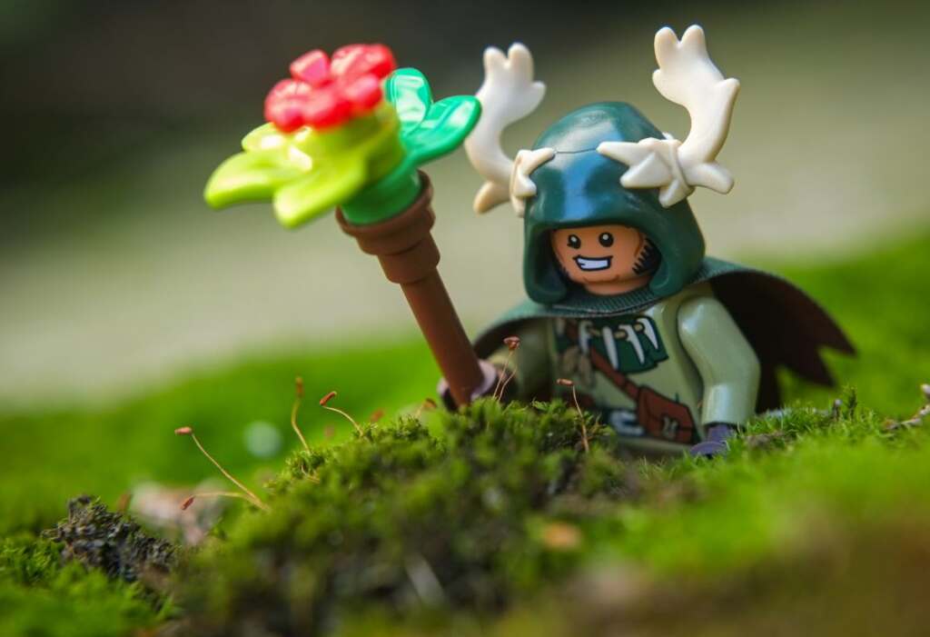 LEGO male Halfling Druid smiling at moss